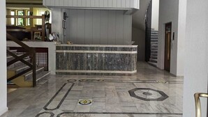 A modern kitchen with a marble countertop and a built-in stove. - Dias (Kusadasi)