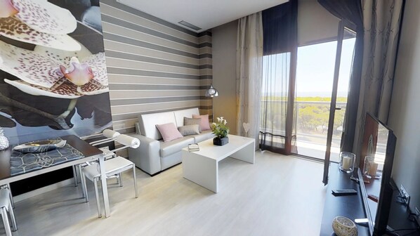 Appartement, 2 slaapkamers, uitzicht op zee (Suite) | Woonruimte | Een 26-inch lcd-televisie met digitale zenders en televisie