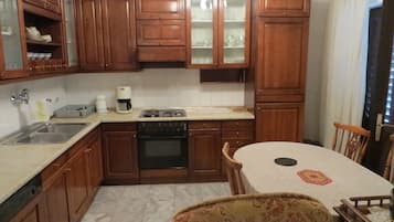 Family Apartment | Private kitchen | Fridge, electric kettle