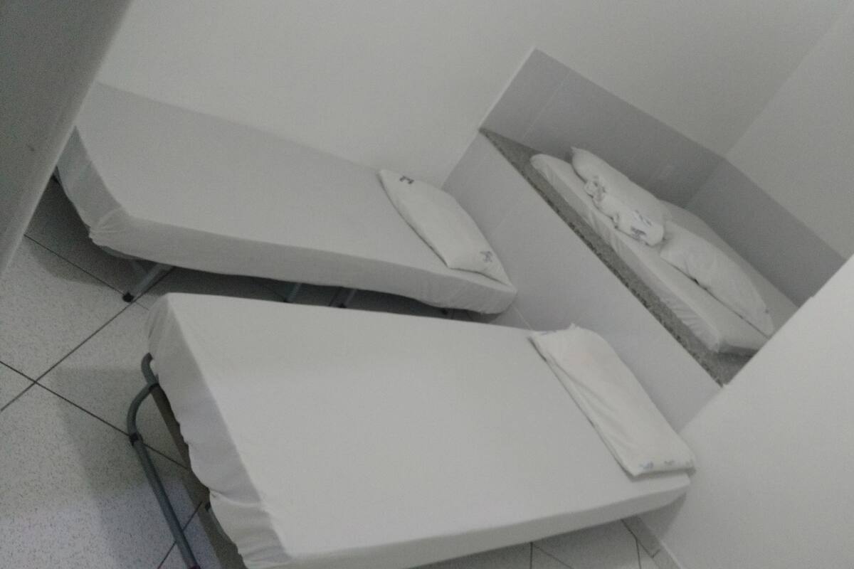 Economy Quadruple Room | Minibar, blackout curtains, bed sheets
