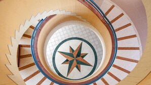 A spiral staircase with a star pattern at the center. - Akiris (Nova Siri)