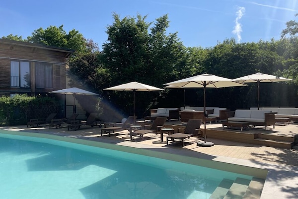 Seasonal outdoor pool, pool umbrellas, pool loungers