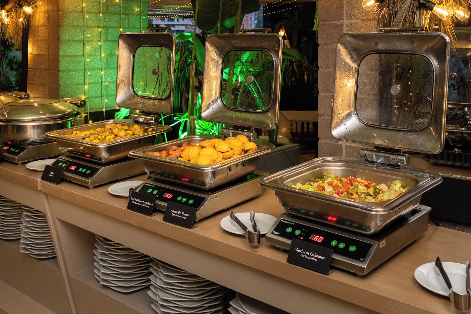 A buffet with various food options, including fried items, salads, and hot vegetables.