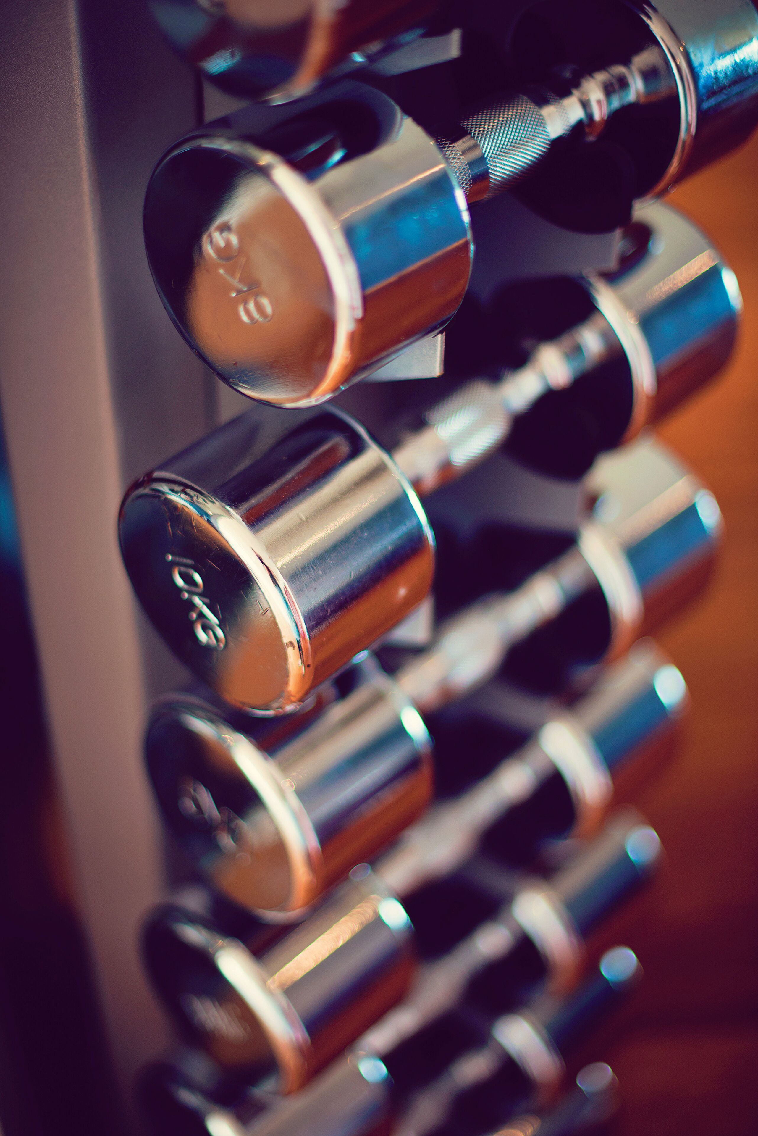 A close-up of metallic cylindrical objects, likely part of a mechanical or industrial system.