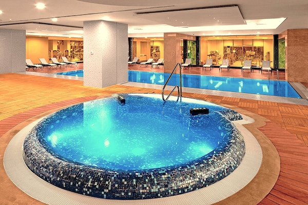 Indoor pool, seasonal outdoor pool, pool umbrellas, sun loungers