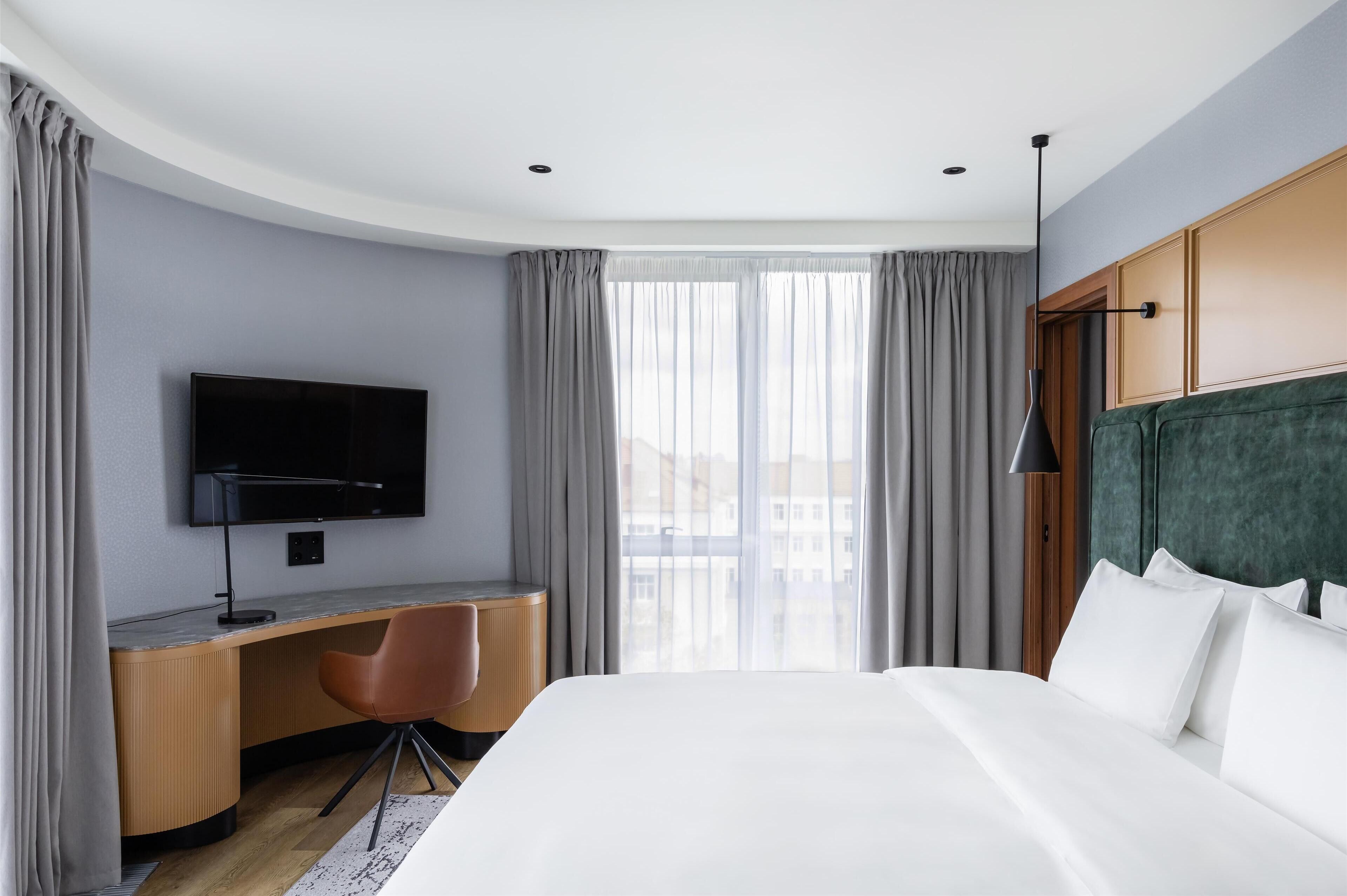 Executive Room | Premium bedding, down comforters, minibar, in-room safe