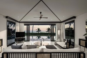 3 Bedroom Pool Villa, Oceanfront (Spa Inclusive) | Living room | 42-inch LCD TV with satellite channels, TV, books - TIA Wellness Resort - Spa Inclusive (Da Nang)