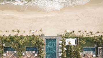 Private beach, white sand, sun loungers, beach umbrellas