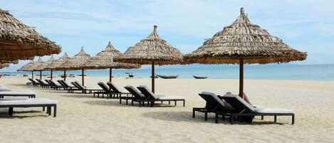Private beach, white sand, sun loungers, beach umbrellas