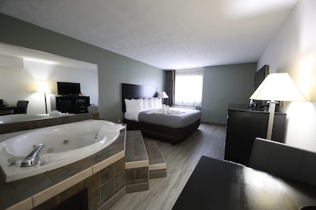Individually decorated, desk, laptop workspace, blackout drapes. Quality Inn & Suites Mattoon South