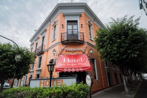 Classic hotel exterior with a prominent entrance and urban surroundings.
