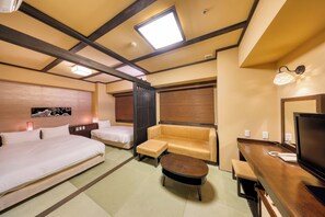 A hotel room with a bed, a sofa, a small table, a TV, and a window with blinds. - Hida Hanasatonoyu Takayama Ouan (Takayama)