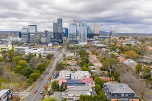 A cityscape with modern high-rise buildings, a main road, and surrounding residential areas. - Motel Maroondah (Mont Albert)