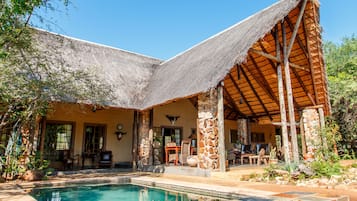 Outdoor pool, open 6:00 AM to 6:00 PM, pool umbrellas, sun loungers