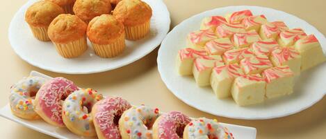 A variety of pastries on plates.