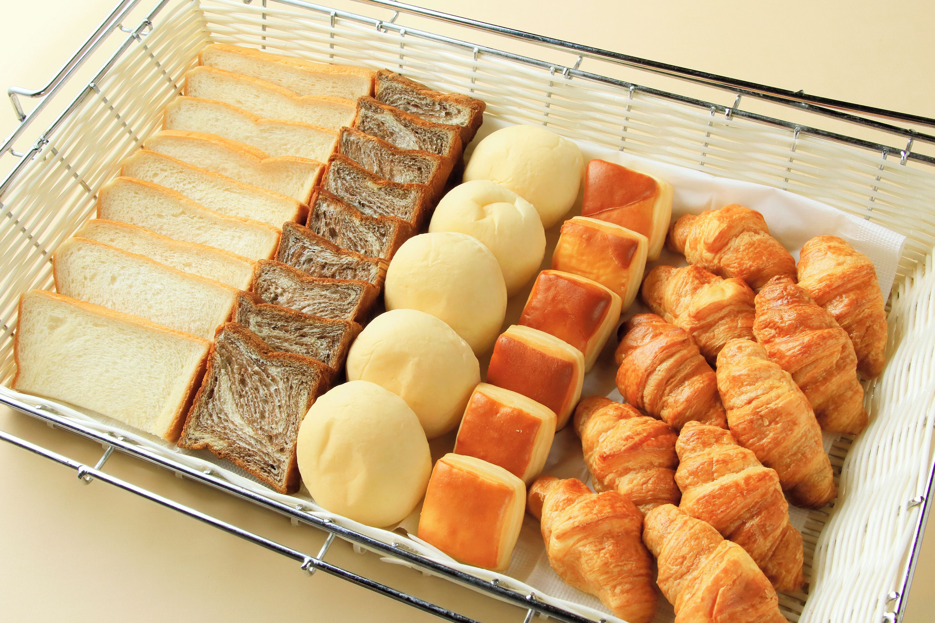 A tray of assorted bread and pastries.