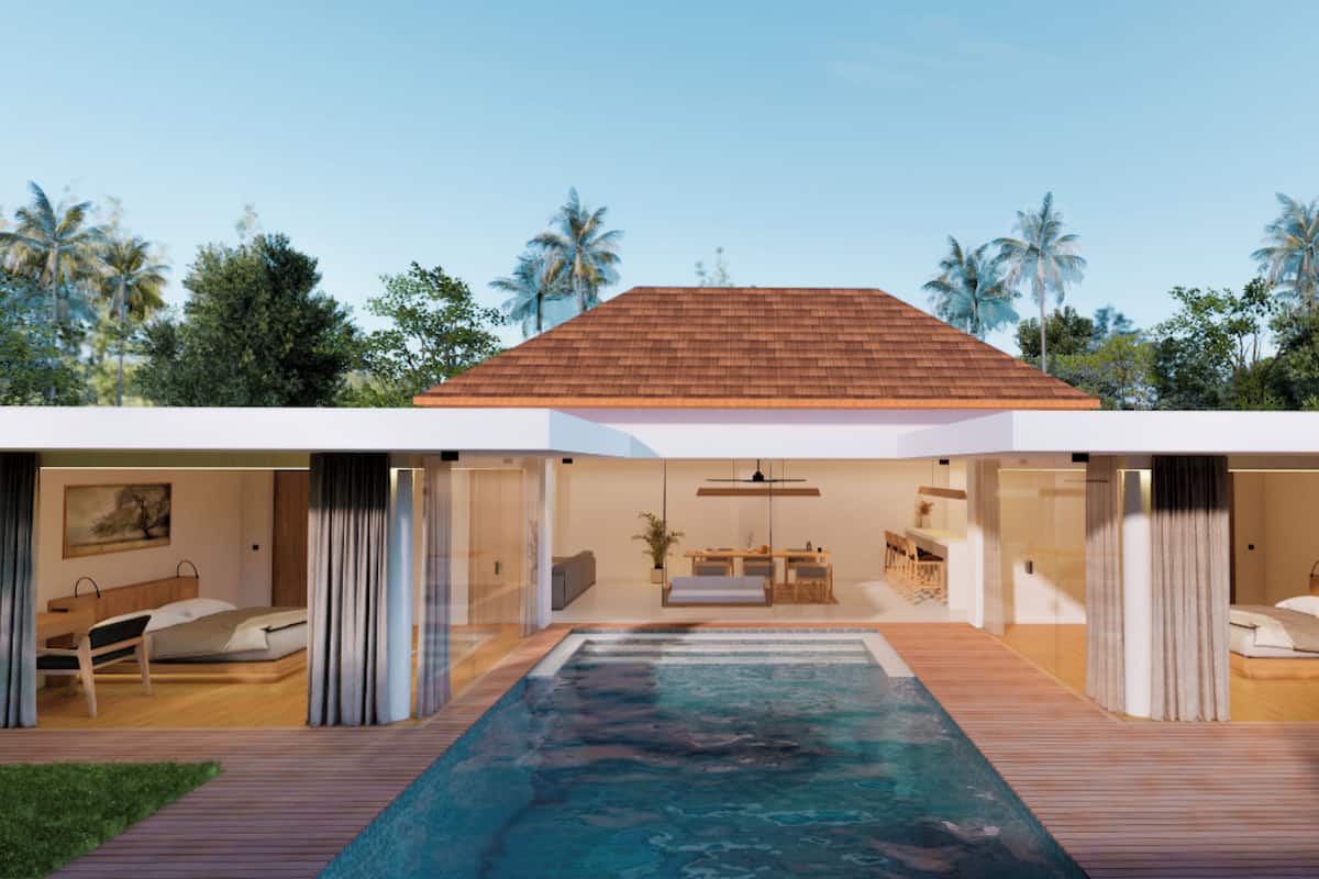 A modern house with a swimming pool, wooden deck, and a dining area with a view of the pool.