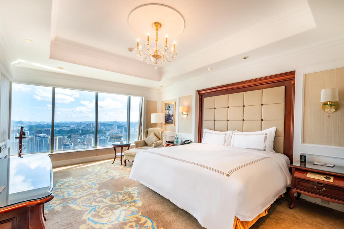 deluxe room, 1 king bed, river view | minibar, in-room safe, desk, laptop workspace