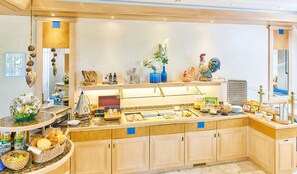 A well-equipped kitchen with a buffet setup, including various food items and decorative elements. - Hotel-Restaurant Kerzenstüble (Gaertringen)