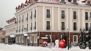 A hotel with a sign reading "HOTEL RESTAURANT" and a visible entrance. - Optima Collection Kamianets-Podilskyi (Kamianets-Podilskyi)