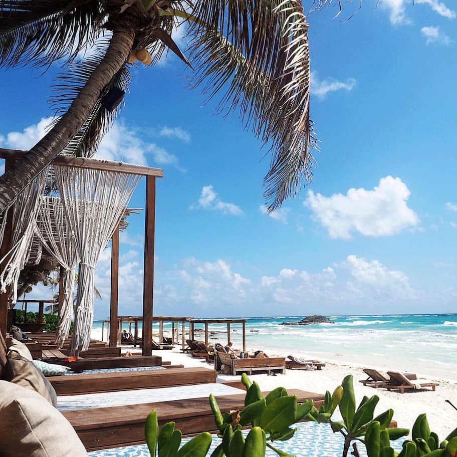On the beach, white sand, beach umbrellas, beach towels