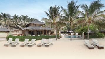 On the beach, sun-loungers, beach umbrellas