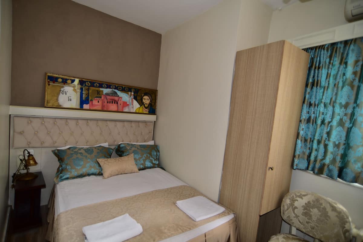 Habitación individual | Camas Select Comfort, minibar y caja de seguridad en la habitación