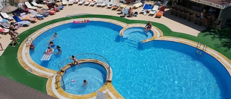 Seasonal outdoor pool, open 8:30 AM to 7:30 PM, pool umbrellas