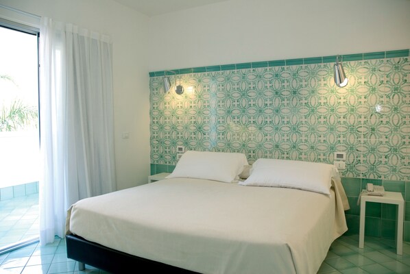 Premium bedding, down comforters, minibar, in-room safe