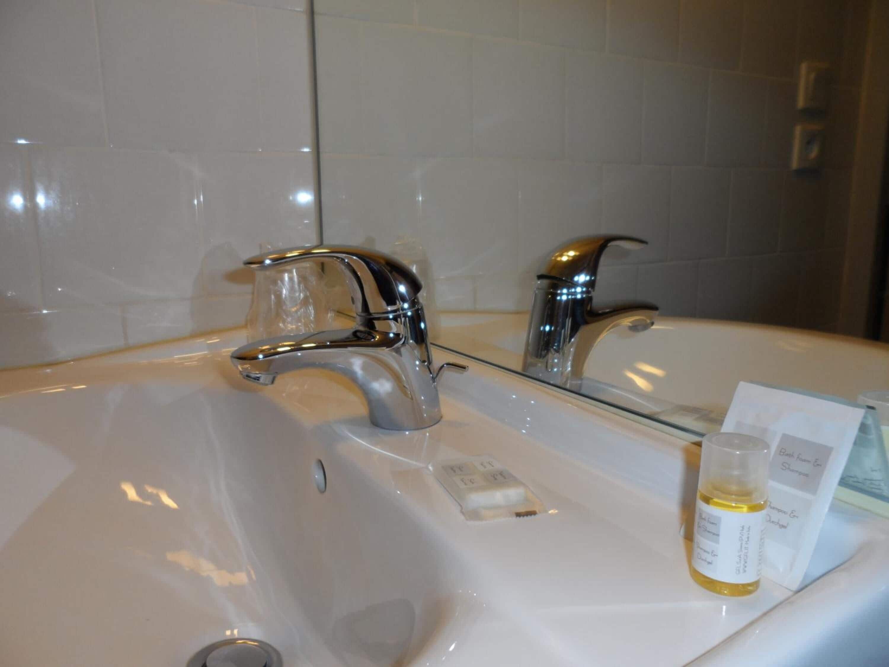 bathtub, free toiletries, hair dryer, towels