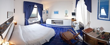 Deluxe Suite, Sea View, Annex Building | Minibar, in-room safe, individually decorated, individually furnished