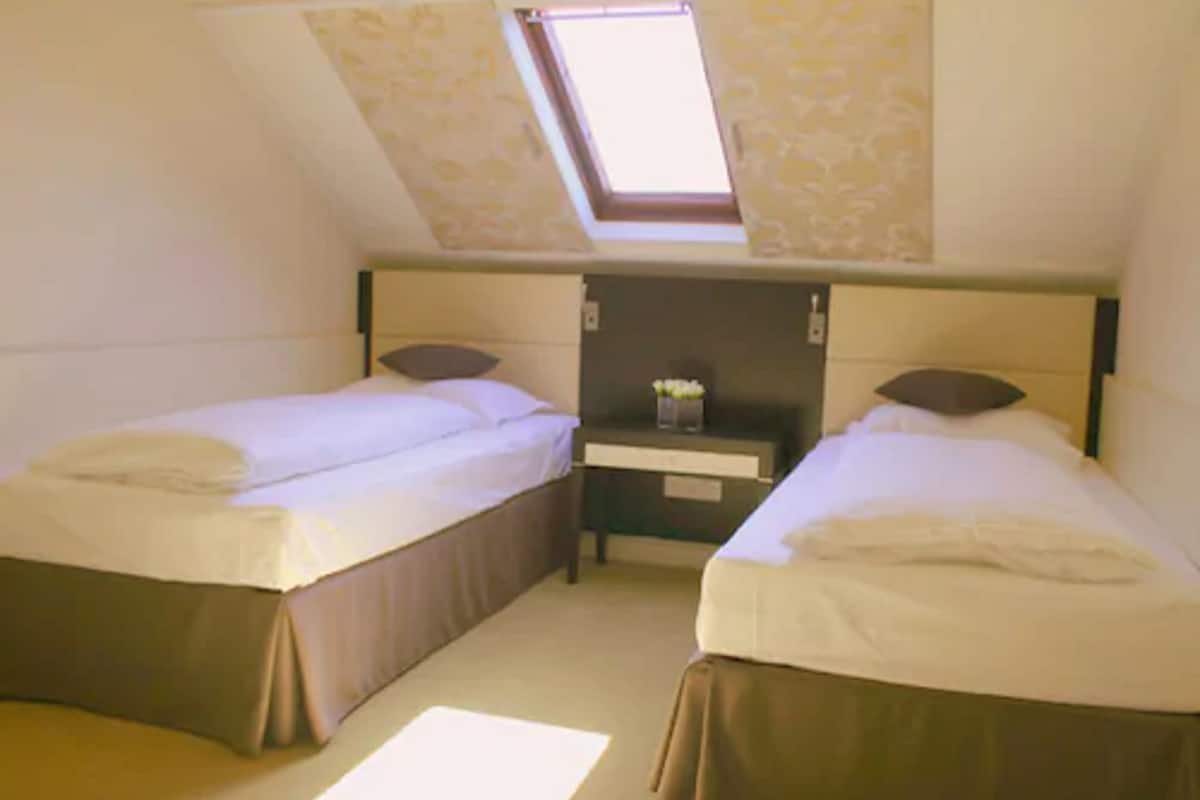 Family Suite, 2 Bedrooms | Desk, iron/ironing board, free WiFi, bed sheets