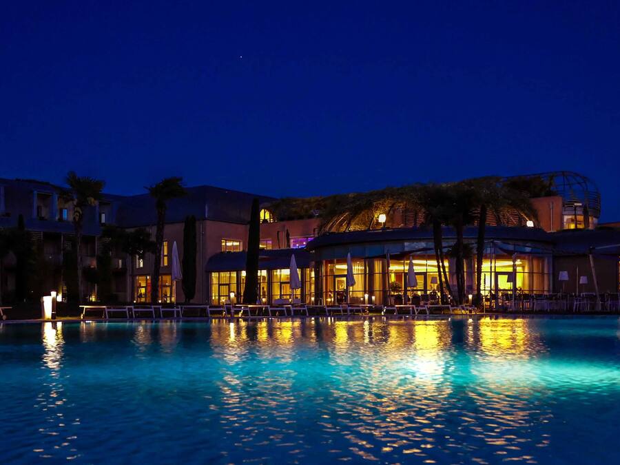 Indoor pool, outdoor pool, pool umbrellas, pool loungers