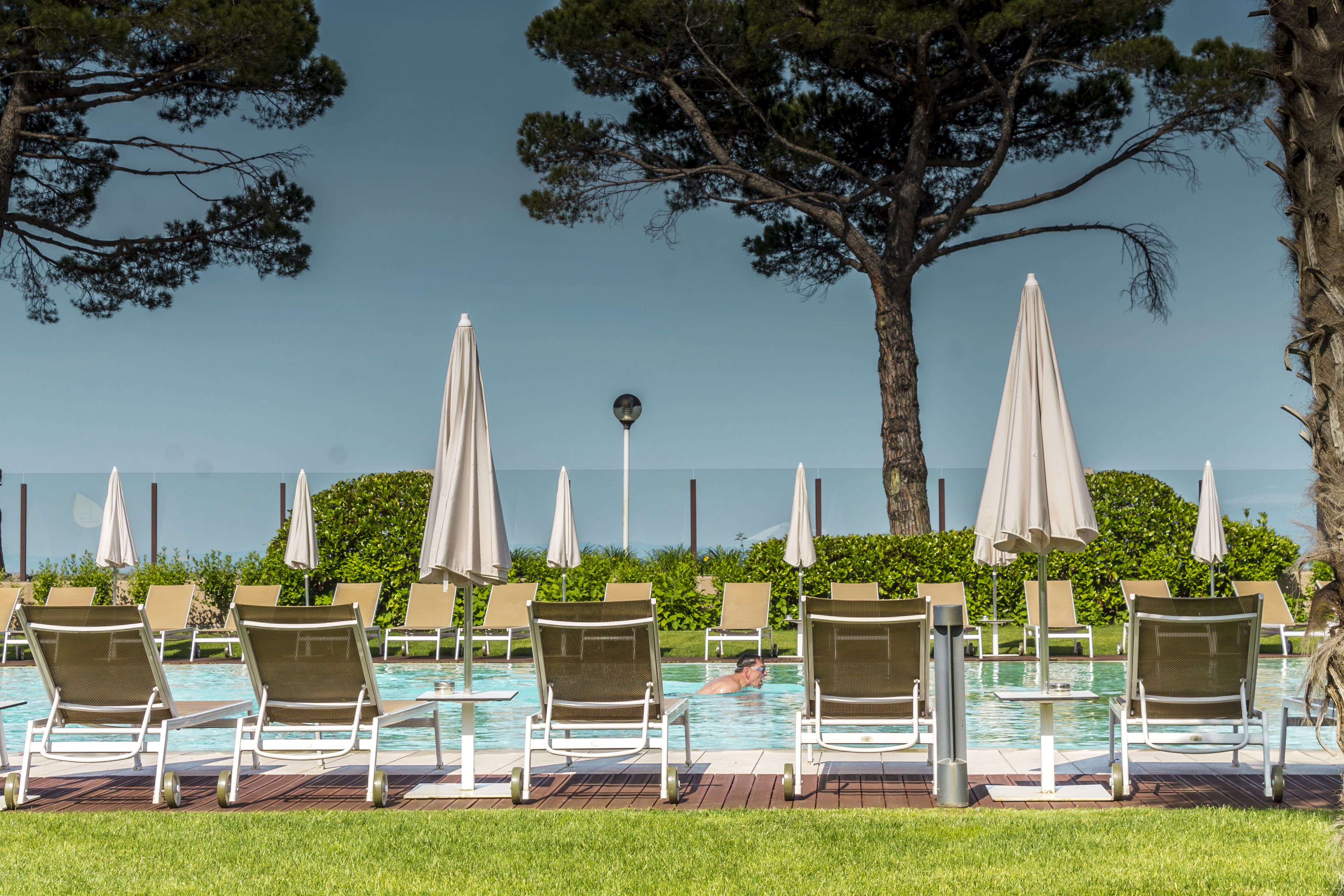 indoor pool, outdoor pool, pool umbrellas, pool loungers