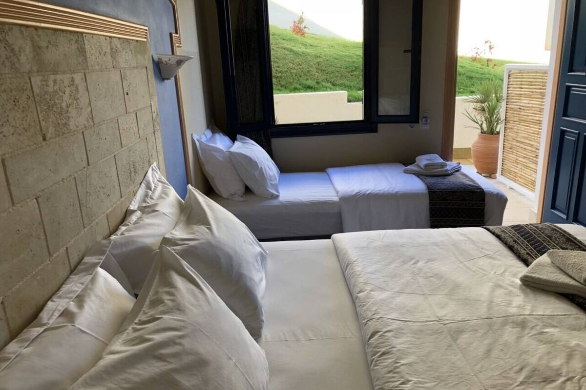 Standard Triple Room | Minibar, in-room safe, desk, soundproofing