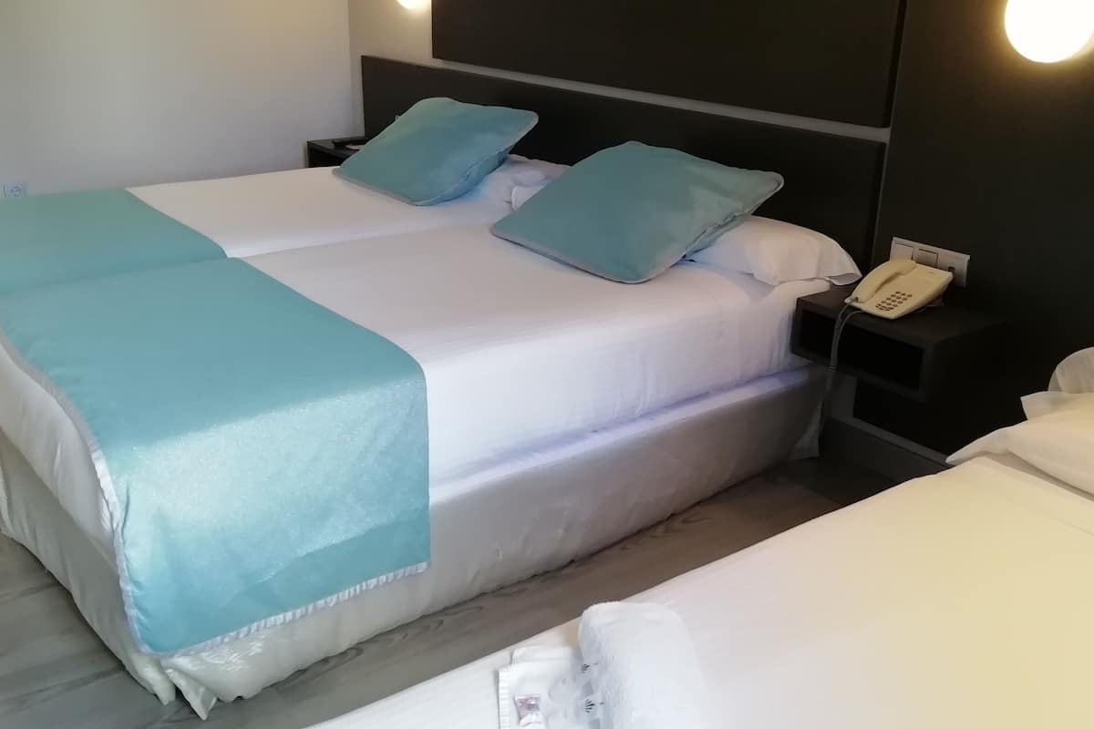 triple room | 1 bedroom, premium bedding, minibar, in-room safe