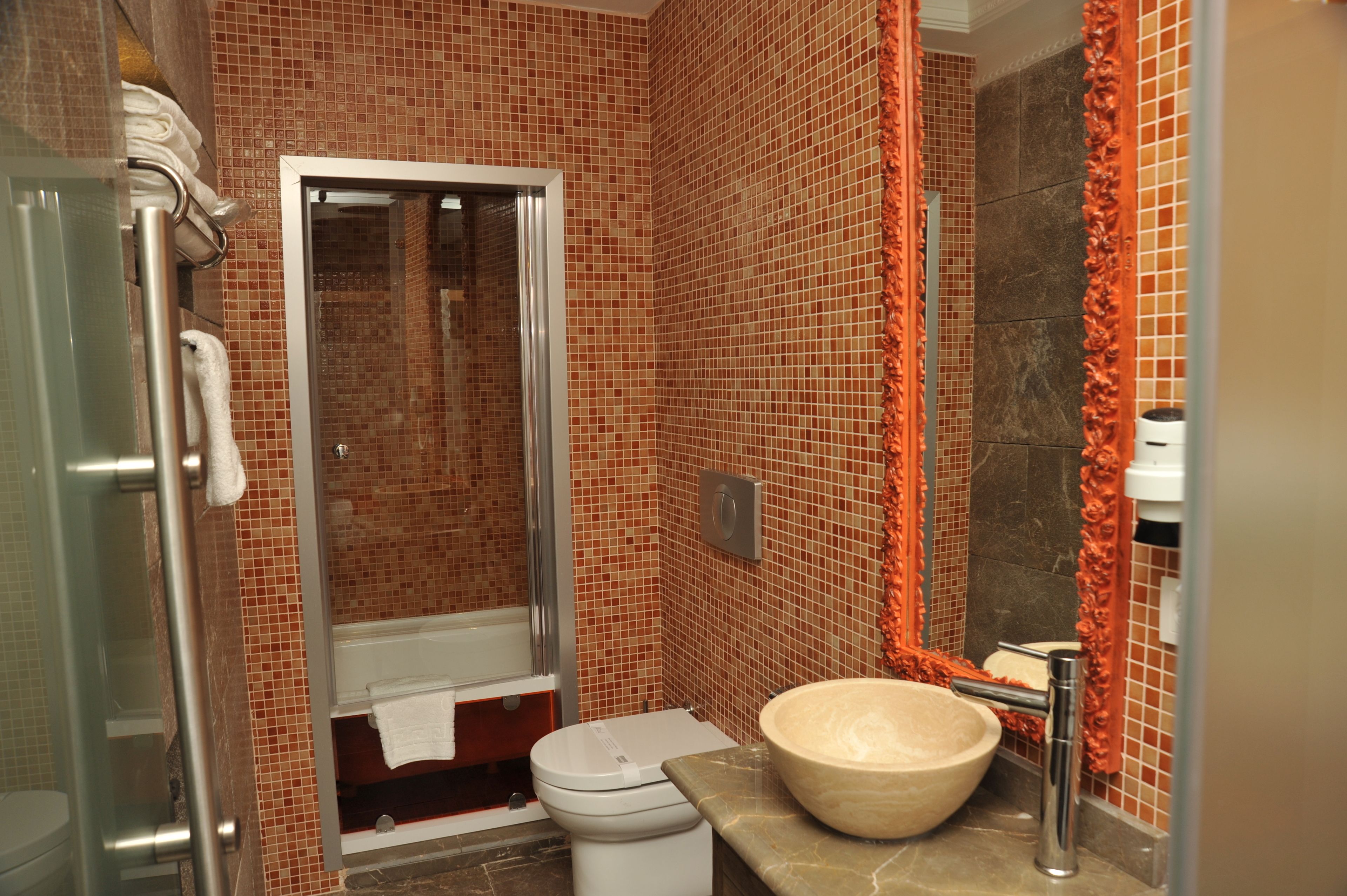 deluxe suite | bathroom | bathtub, deep-soaking bathtub, rainfall showerhead, hair dryer