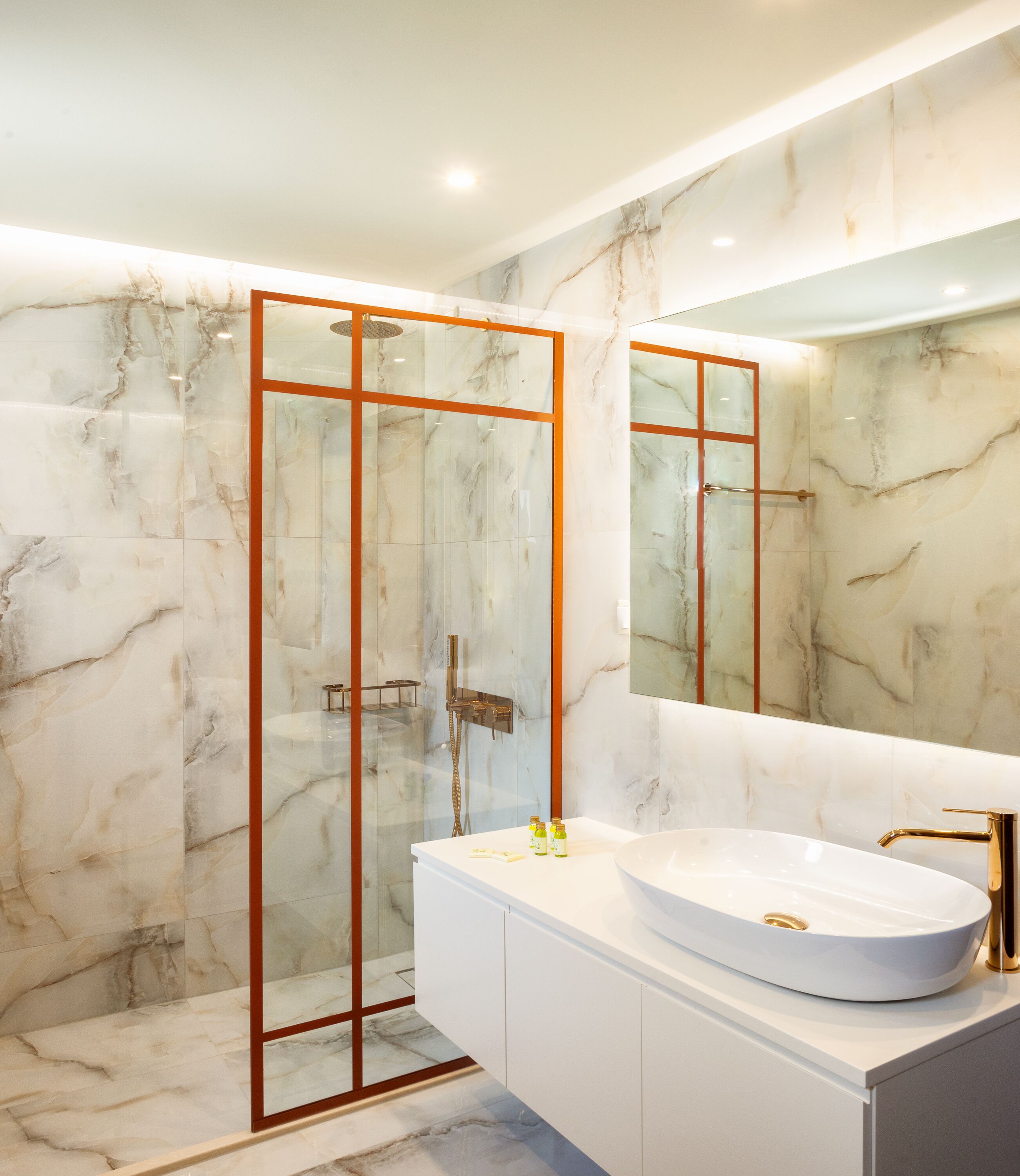 grand luxury suite with panoramic view | bathroom | rainfall showerhead, designer toiletries, hair dryer, slippers