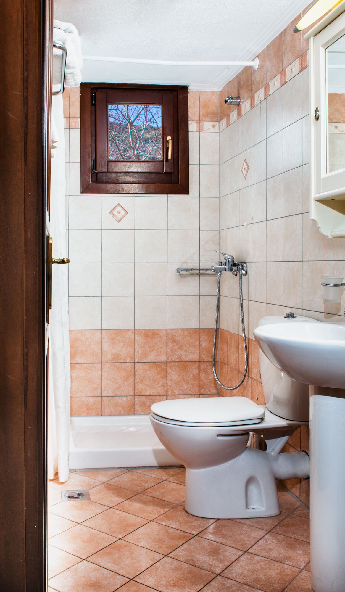 rainfall showerhead, designer toiletries, hair dryer, slippers