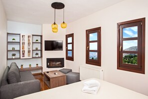 Junior Suite, Fireplace | Premium bedding, pillowtop beds, in-room safe, individually decorated - Erofili Hotel and Suites (Volos)
