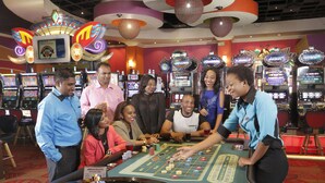 A casino floor with multiple slot machines and a roulette table. - Peermont Metcourt Hotel at Umfolozi (Empangeni)