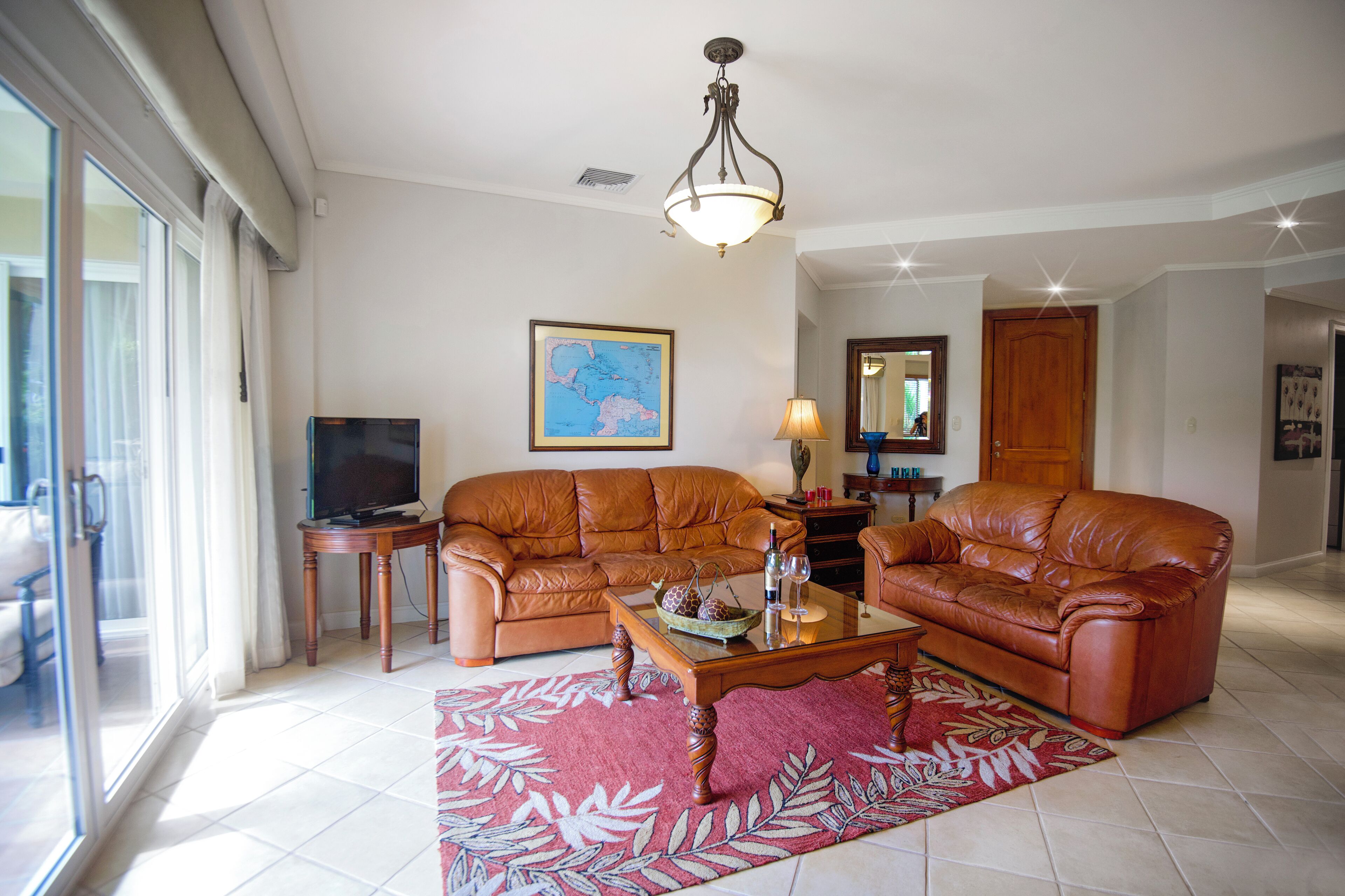 deluxe condo, 3 bedrooms | living area | 32-inch tv with cable channels