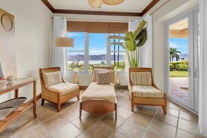 Premium Condo, Ocean View | Living area | 32-inch TV with cable channels