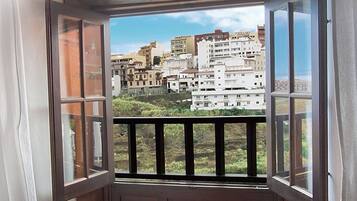 Desk, blackout curtains, iron/ironing board, bed sheets