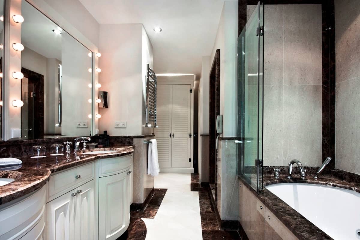 separate bathtub and shower, designer toiletries, hair dryer, bathrobes