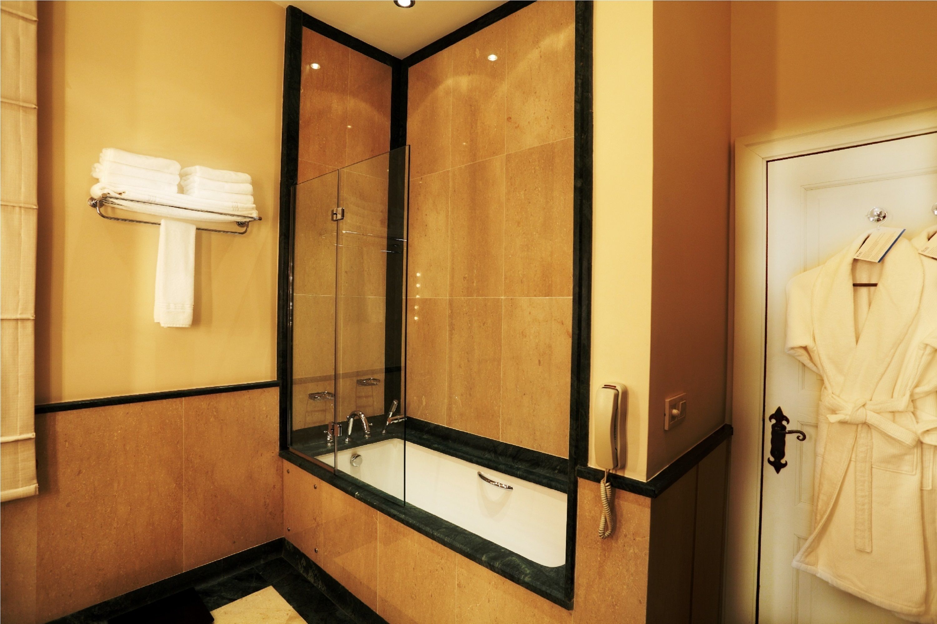 junior suite | bathroom | separate bathtub and shower, designer toiletries, hair dryer, bathrobes