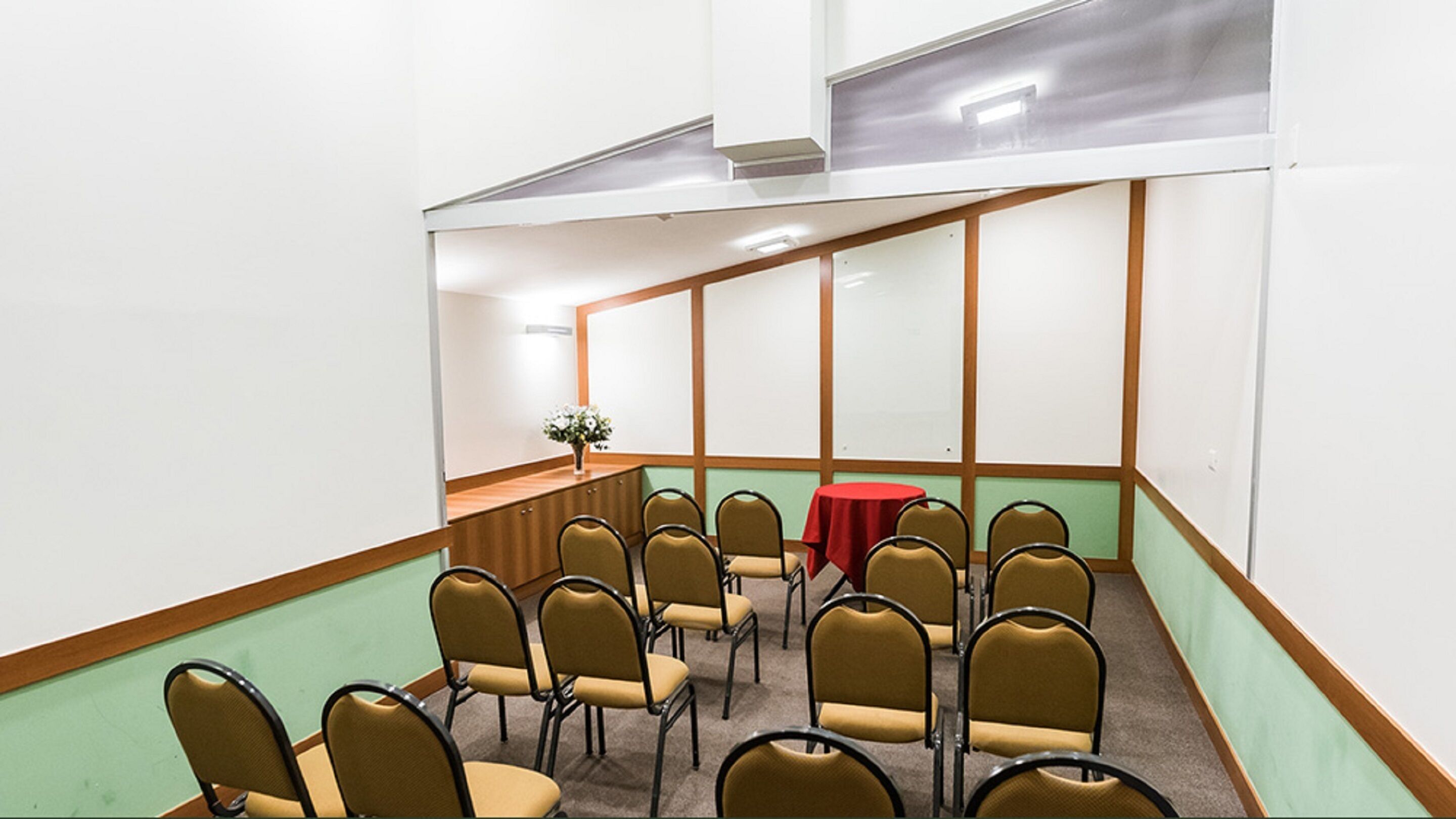 A conference room with a long table and chairs arranged for meetings.