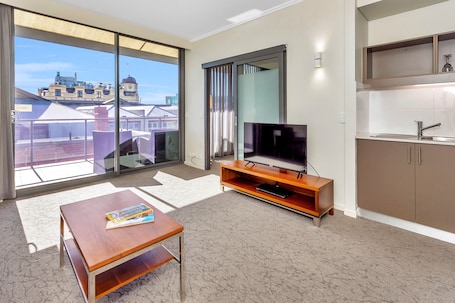 New Haus Suite With Balcony | Living area | 43-inch Smart TV with digital channels, TV