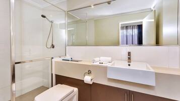 Shower, designer toiletries, hair dryer, towels