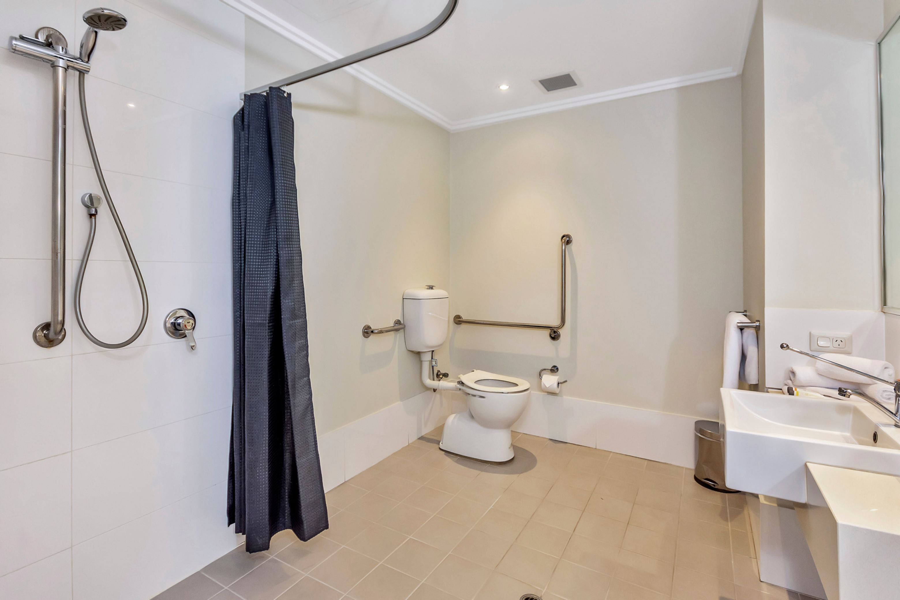 new haus studio | bathroom | shower, designer toiletries, hair dryer, towels